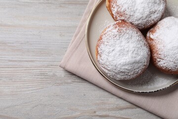 Delicious sweet buns on wooden table, top view. Space for text