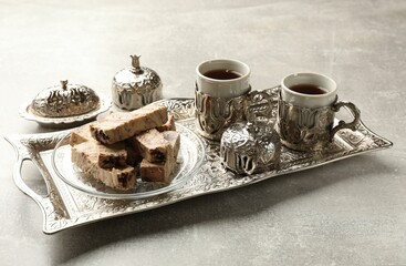 Tasty chocolate halva served on light grey table