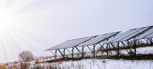 Solar panels Photocells on a gloomy foggy frosty winter day in the countryside. Solar batteries are an alternative energy