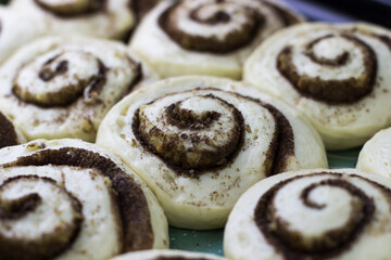 The process of making cinnabons. Cinnamon roll dough on a baking mat