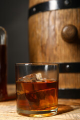 Glass of cold rum on table