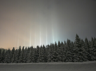 A light pillar is an atmospheric optical phenomenon in which a vertical beam of light appears to...