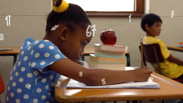Animation of numbers over african american schoolgirl writing in notebook at school