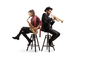 Male and female musicians sitting on chairs and playing a sax and a trumpet