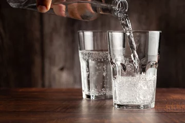 Foto op Aluminium Glass of cold sparkling water. © WS Studio