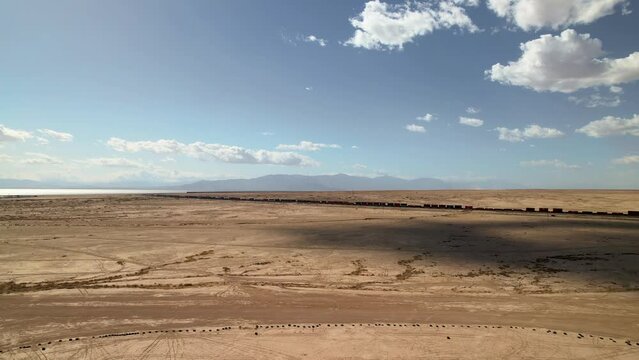 Drone Footage of Freight Train in Desert Near Bombay Beach, California: 4K Aerial View Alongside Salton Sea