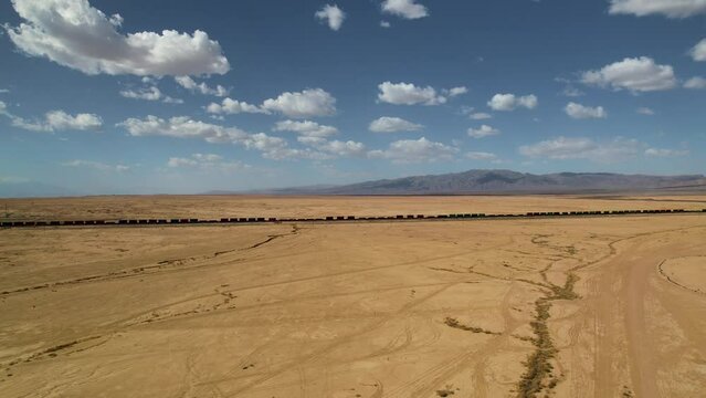 Top cinematic aerial view to the abandoned cargo train in Bombay beach, California USA. Drone footage. Landmarks of USA. Ghost city. 