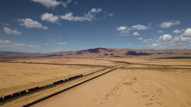 Panoramic aerial view to the wild nature and desert landscape of Bombay Beach with amazing mountain on the background, California. Cinematic drone footage. Landmarks of US. 