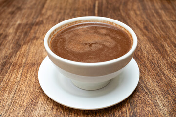 Cup of hot chocolate served on the table - Theobroma cacao