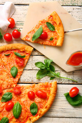 Board with tasty pizza margarita on white wooden background