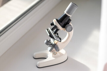 lose up shot of the microscope on the window. Science