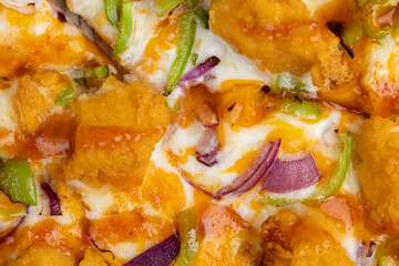 Fresh pizza with cheese and red onion with green pepper