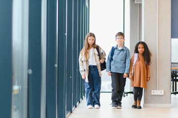 Group of elementary school kids in a school corridor