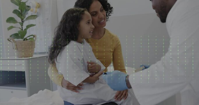 Animation of heart rate monitor over african american male doctor talking to girl patient and mother