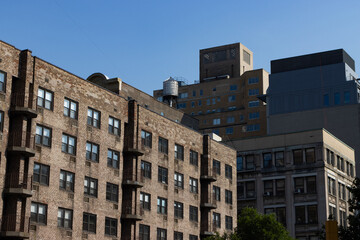Fototapeta na wymiar Brick Residential and Apartment Buildings in Chelsea of New York City