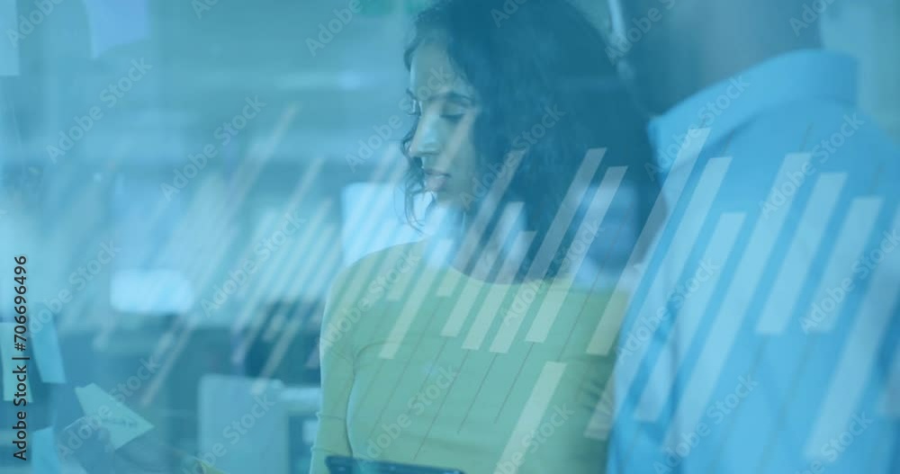 Poster animation of graph over diverse coworkers discussing strategy on sticky notes in office