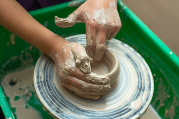Clay, pottery or hands in designer workshop working on an artistic cup or mug mold in small business studio. Hand of creative artist or worker manufacturing handicraft products in sculpture