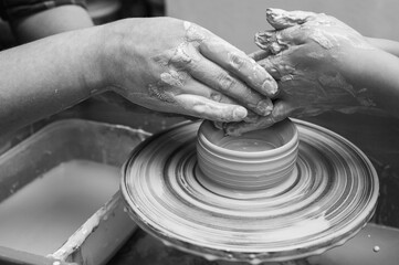 Black and white photo, clay, ceramics or hands in a design workshop working on an artistic cup or mug in a small business studio. Makes crafts in sculpture
