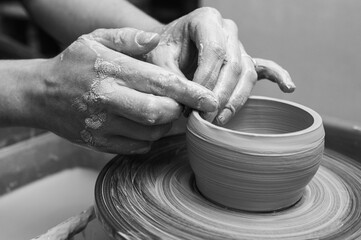 Black and white photo, clay, ceramics or hands in a design workshop working on an artistic cup or mug in a small business studio. Makes crafts in sculpture