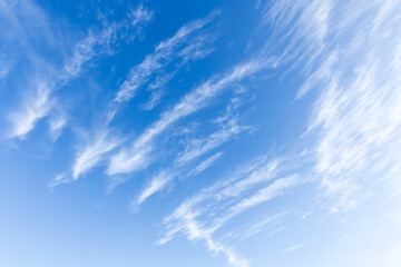 Naklejka na ściany i meble Cirrus clouds are in blue sky, natural background photo texture