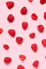 Many fresh raspberries on pink background
