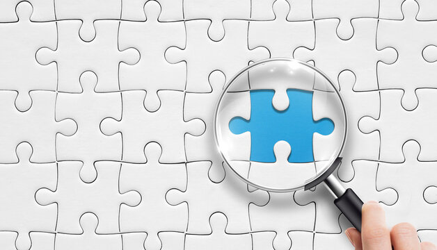 Searching Missing Piece. Search for missing last puzzle piece with magnifying glass. 