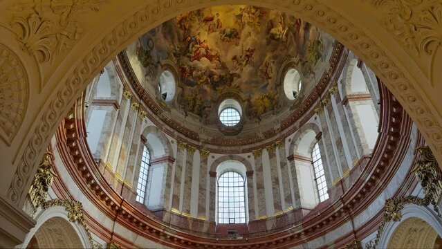 Revealing the interior fresco ceiling of Karlskirche Cathedral (St. Charles's Church) with a vaulted dome, Vienna, Austria