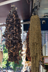Dried okra and aubergines on a string at the farmers' market.