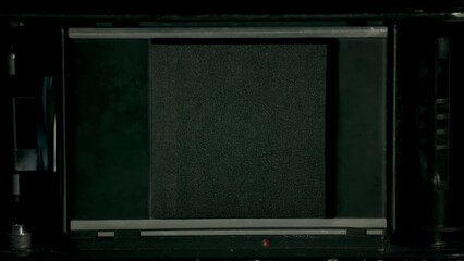 Extreeme cloeup of a film camera shutter. Closeup of shutter operation. Slowmotion, footage 4K. 