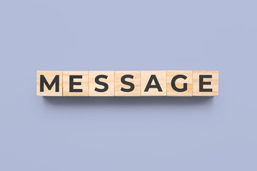 message wooden cubes on blue background