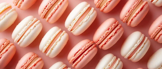 Foto op Canvas A pattern of gourmet macarons laid out in an orderly grid on a peach background .a top-down view of macarons in a symmetrical pattern.  © png-jpeg-vector