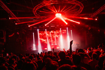 Crowded nightclub with vibrant light show