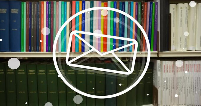 Animation of spots and envelope icon over books on shelves in library