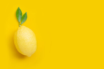Fresh lemon on yellow background.