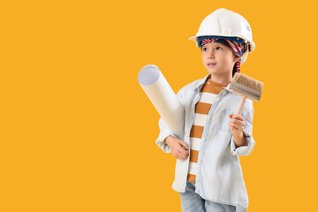 Cute little decorator with paint brush and house plan on yellow background. Opposite Day celebration