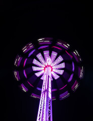 illuminated carousel in a city at night