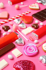 Obraz na płótnie Canvas Many different tasty sweets on pink background. Valentine's Day celebration