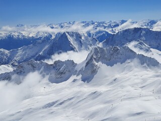Snow covered mountain top in Austria. View of the Alps from the Zugspitze, the highest mountain in...