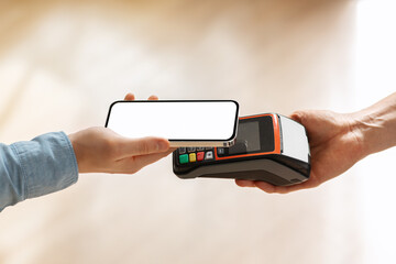Hand of young european man using smartphone with empty screen for payment machine