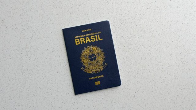 Close-up of the Brazilian passport against a white background, symbolizing travel and citizenship. Clear image of a Brazilian passport on a white background, emphasizing authenticity and simplicity.