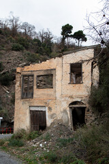 Abandoned, decrepit house with broken windows