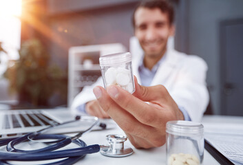 doctor holding bottle of pills. The concept of medicine, pharmacology, healthcare.