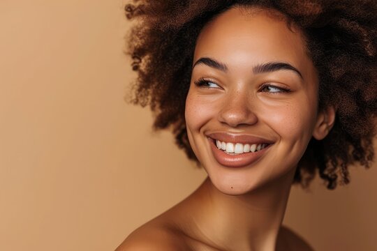 Close-up of a woman's beaming beauty smile, her skin reflecting the benefits of a healthy skincare routine, against a warm beige studio background, exuding happiness and well-being.