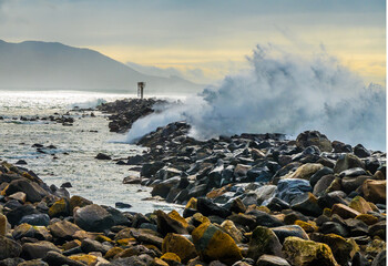 High surf waves crashing over breakwater - obrazy, fototapety, plakaty