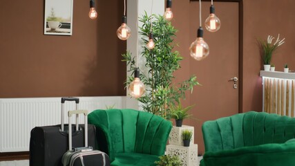 Elegant sofa in the hotel lobby, empty front desk within hotel registration area. Stylish luxury...
