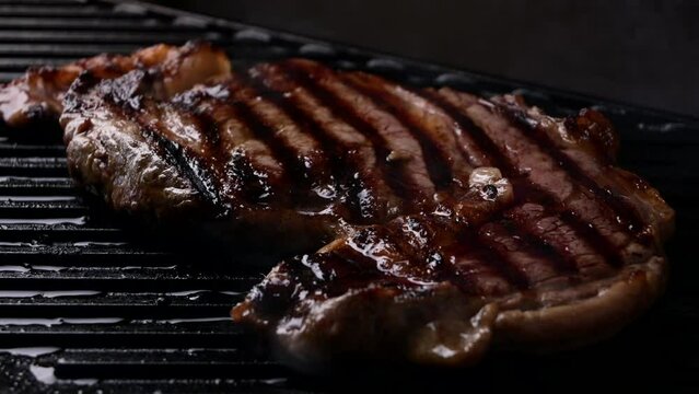 ribeye steak on hot smokey grill