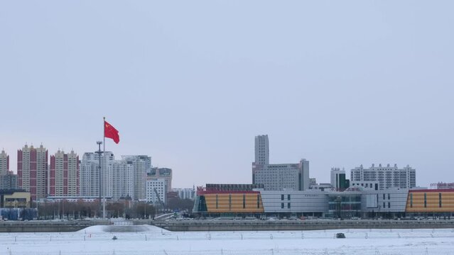 The city of Heihe in winter, on the border with Russia and China, view from the embankment of the city of Blagoveshchensk.
