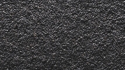 Fototapeta premium Top view of Black sesame seeds. Background texture of raw Black sesame seeds. Superfood. Copy space. Banner. Ideal for culinary and food concepts.