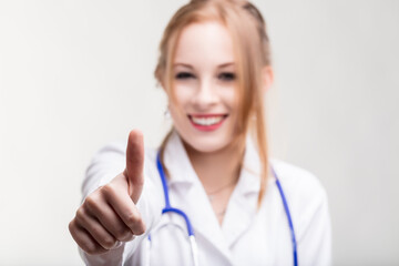 Confident medical professional signals approval with thumb