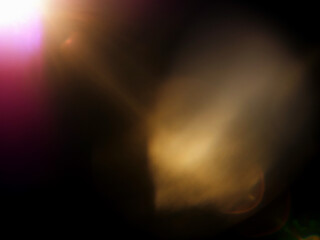 Abstract lens flare on dark background for special lighting effect and graphic design.